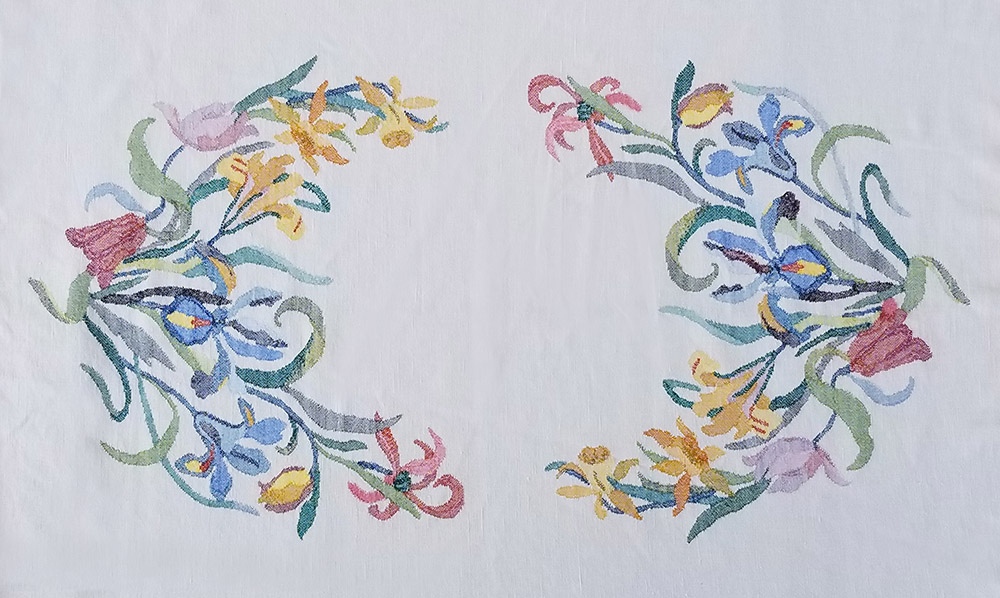 Fig. 2 - Detail of Flower wreath table cloth, c. 1895-1927. Elizabeth Hubbell Fisk, American, 1859-1927, designer; Elizabeth Fisk Looms, Isle La Motte and St. Albans, VT, manufacturer. Cotton. 50 x 39 inches. American Craftsman Museum Collection, donation of Martha T. Dale and the Family of Elizabeth Fisk.