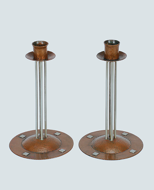 Fig. 6 - Candlesticks (model no. C-42), c. 1910-1912. Attributed to Karl Kipp, American (born Austria), 1882-1954, designer. Roycroft Shops, East Aurora, NY, manufacturer. Copper, German silver. 8 ¼ x 5 x 5 inches (each). TRRF Collection.