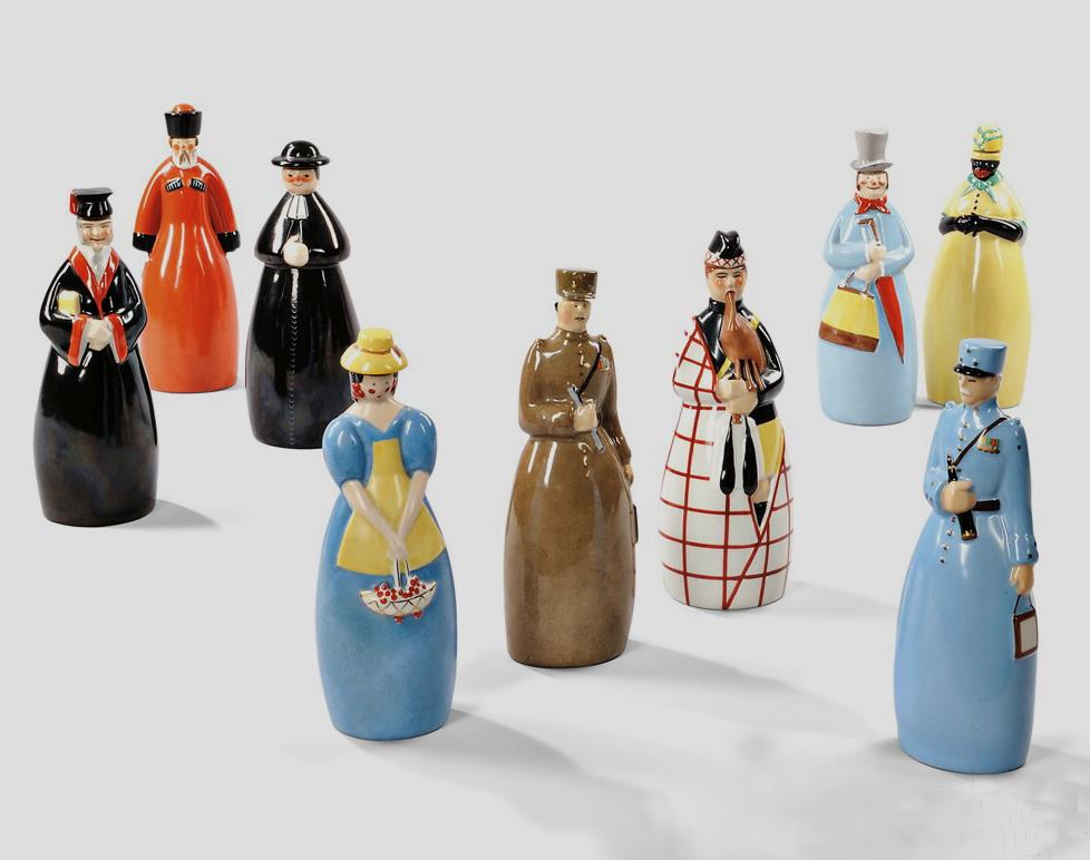 Nine Robj Decanters, Glazed Ceramic, c. 1928-1931, The anthropomorphic containers in various colorful glazes represent: a French general (a paper label with image of General Foch on back), African woman, professor, Russian peasant, bagpiper, a general with field telescope, priest, a beauty with basket,and a gentleman in a top hat, all marked Robj Paris Made in France, approx. ht. 11 in. From the Art Deco Coda Collection from Corinne Davidov